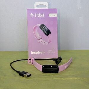 Fitbit Inspire 3 with lilac silicone fitness band and charger